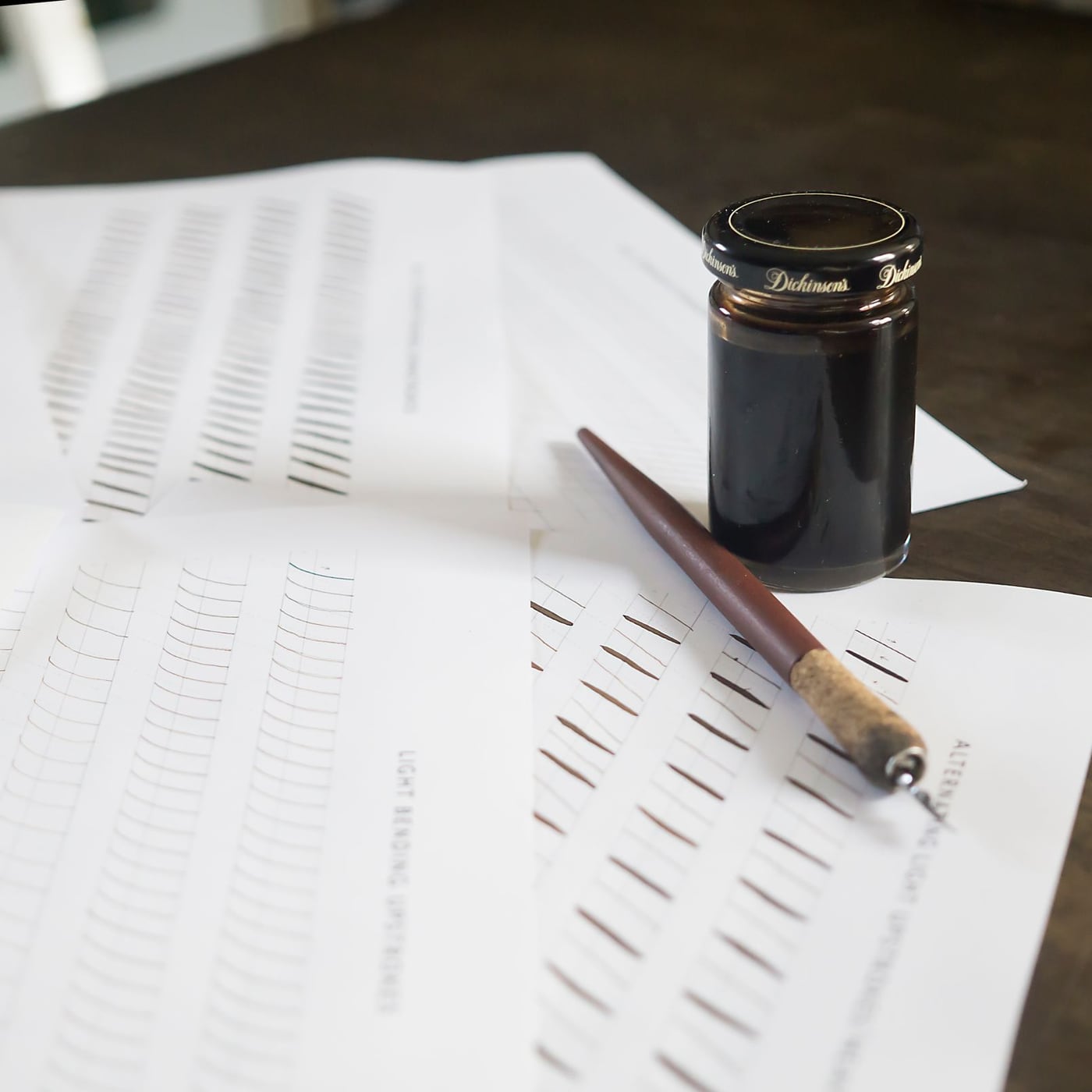 A printed manuscript with professional red ink corrections and a fountain pen.